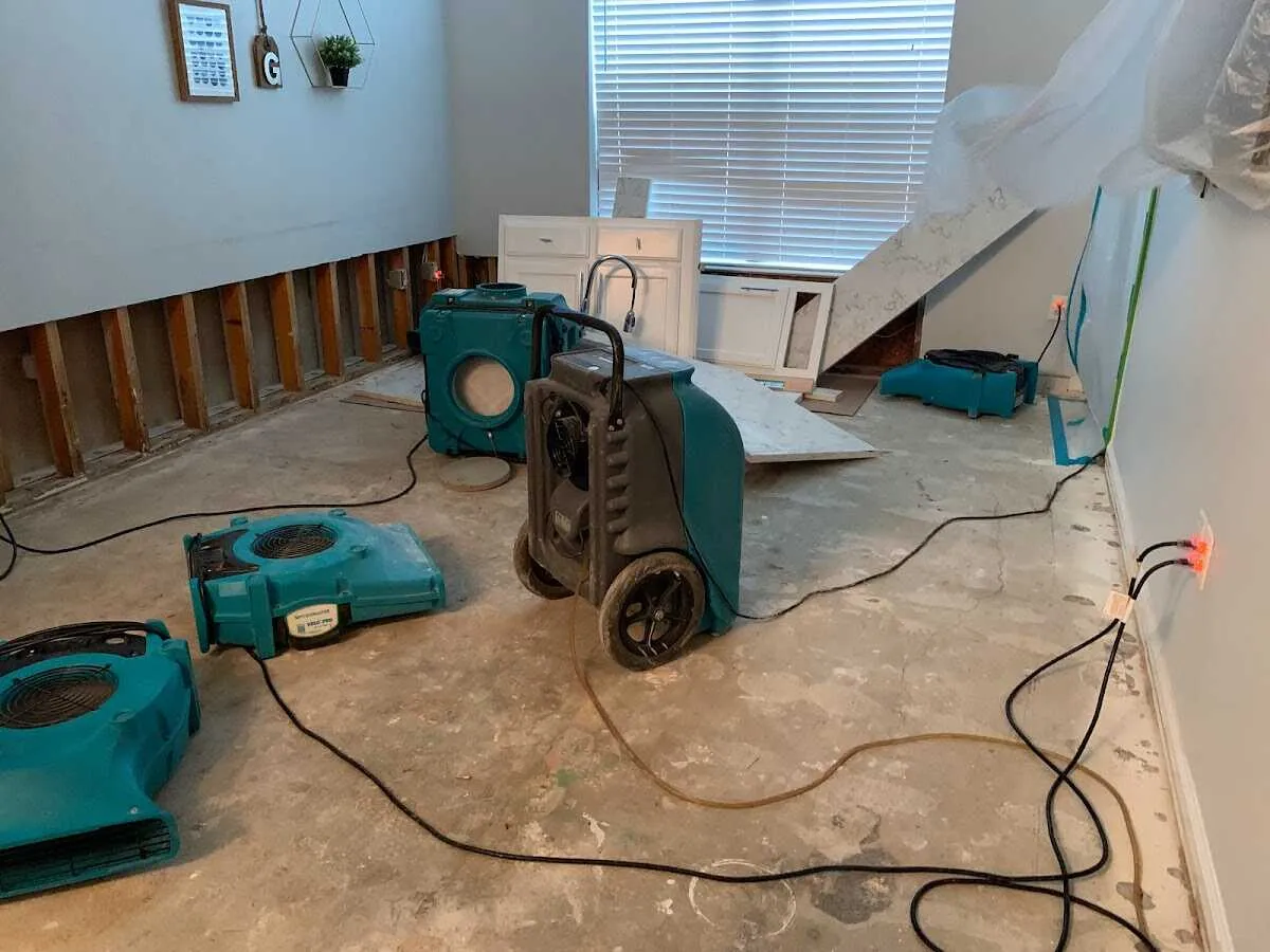 Dehumidifier in flood-cut room for Water Damage Restoration in Littleton